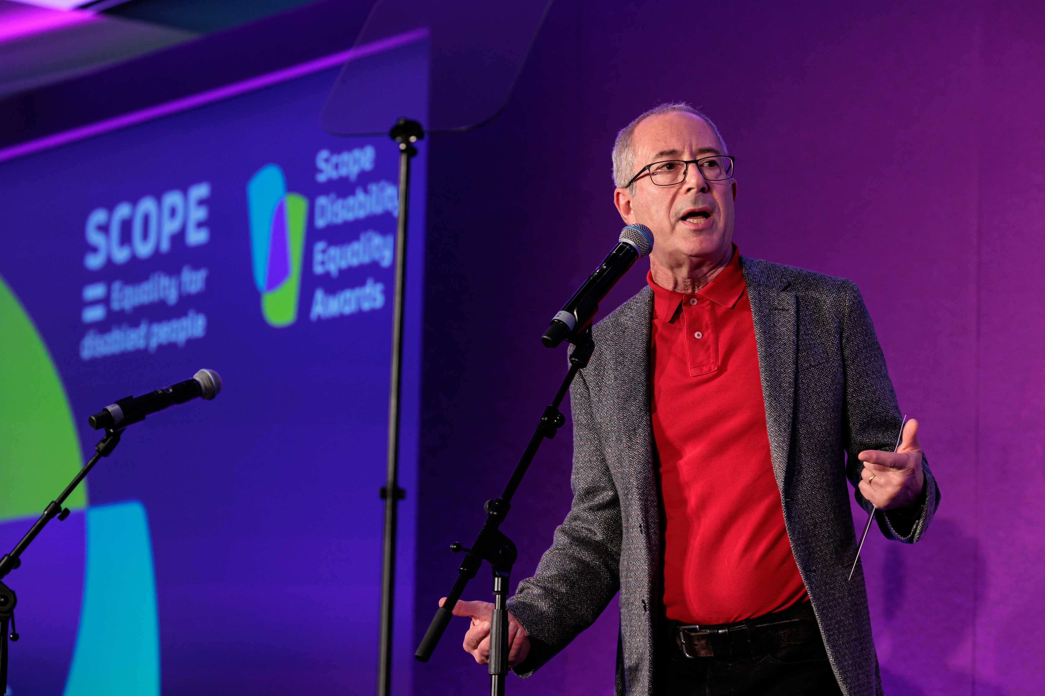 A man speaking into a microphone
